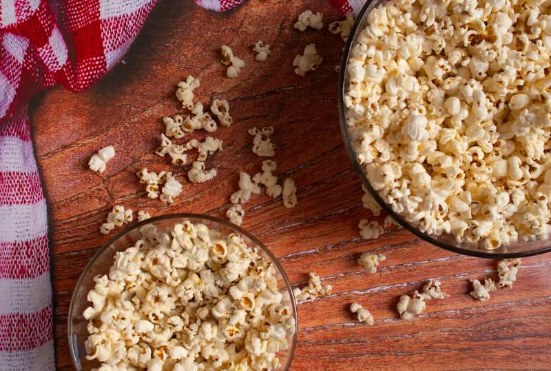 Can You Eat Popcorn With Braces? - The Popcorn Predicament + 7 BETTER Alternatives 2 Can You Eat Popcorn With Braces Buttered Popcorn Sweet Salty Microwave